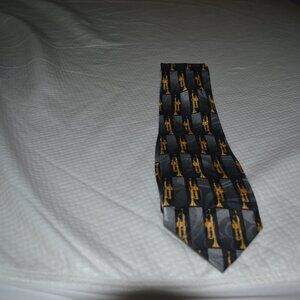 Steven Harris men's necktie. Black with gold trumpet pattern.